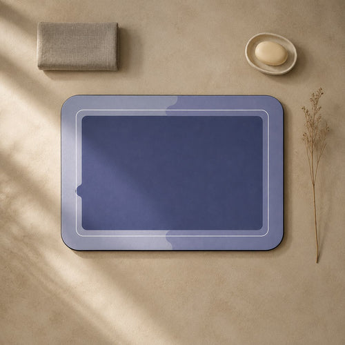 Top-down view of the indigo quick-dry bath mat with a folded linen towel and soap dish