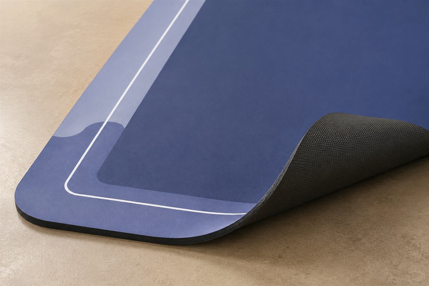 Corner of the mat folded back to show the charcoal non-slip backing