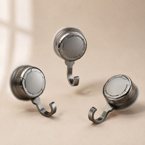 Studio view of the three suction hooks showing the ribbed suction face and hook profile